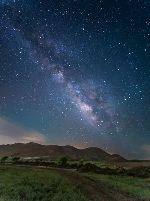 Stars on Night Sky over Countryside