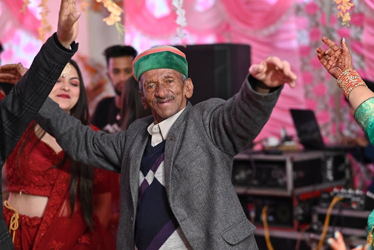 Elderly Man Dancing At Party