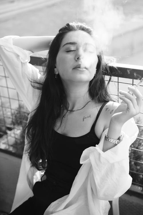 Woman Smoking Cigarette in Black and White