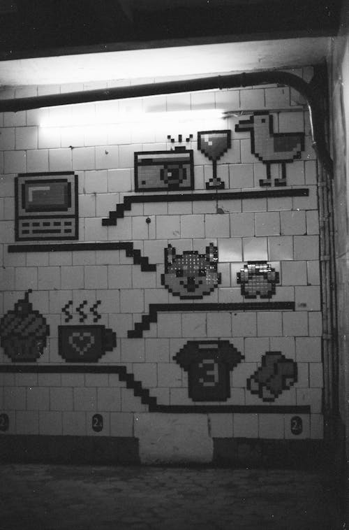 Black and White Photo of a Wall with Pixel Art 