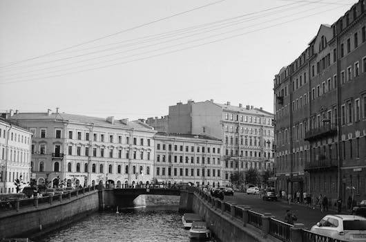 Classic black and white photo of a canal and historic architecture in St. Petersburg, Russia.