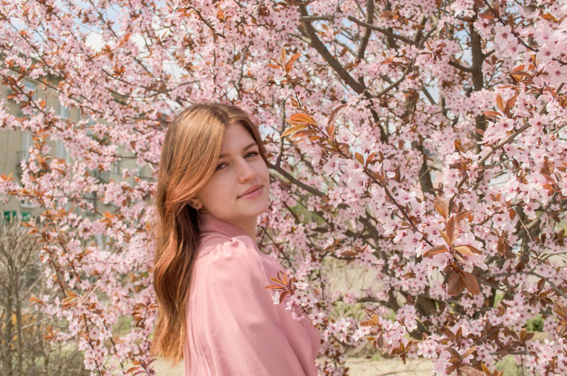 Portrait of a girl in spring flowers with long hair · Free Stock Photo
