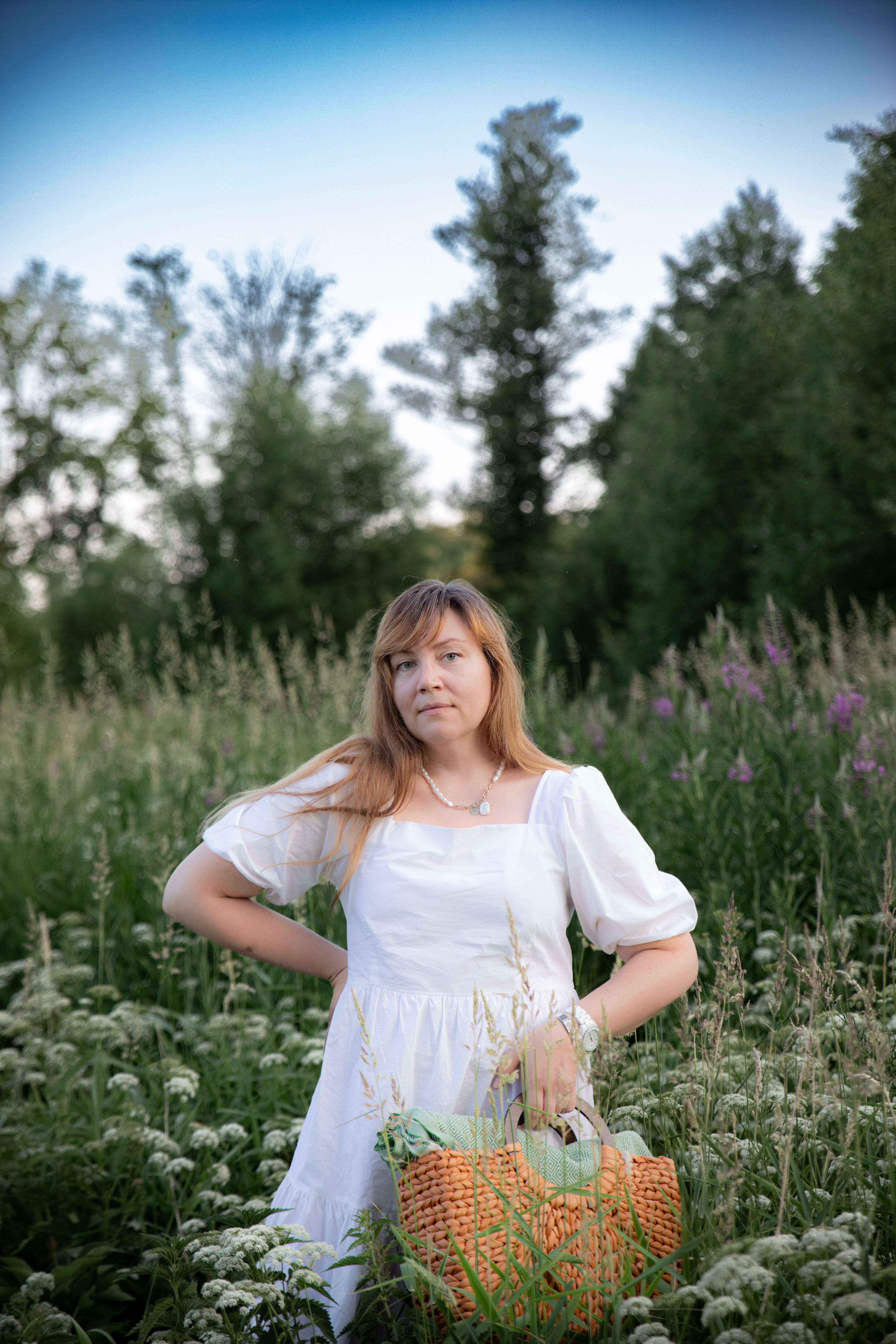 Woman in White Dress Standing on Meadow · Free Stock Photo