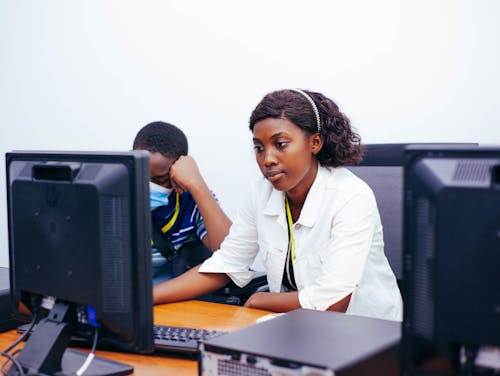 Woman Sitting and Working in Office