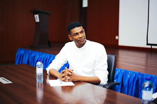 Man Sitting by Table