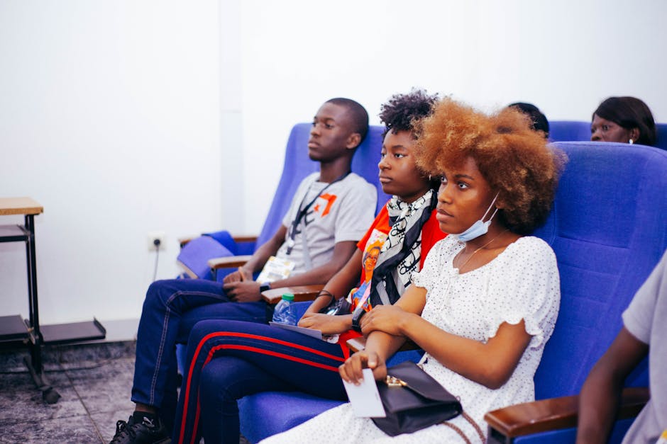 Diverse group of individuals participating in a research focus group, sharing their economic experiences.