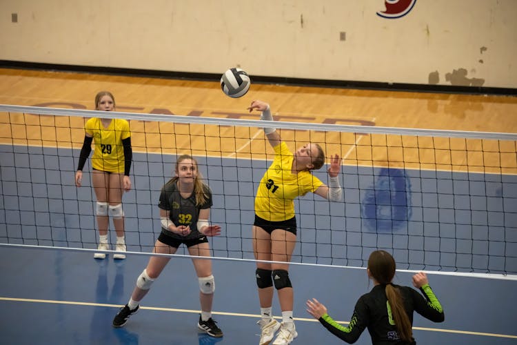 Teenagers Playing Volleyball