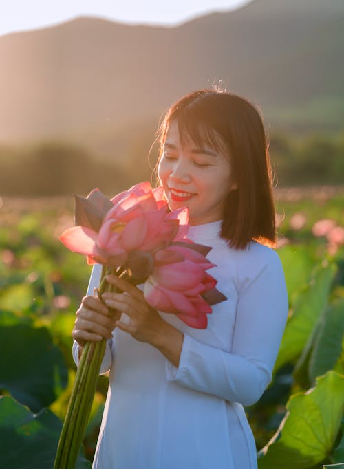 Smiling Woman with Pink Flowers