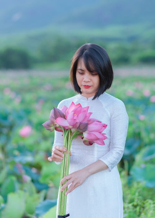 Brunette with Lotus Flowers