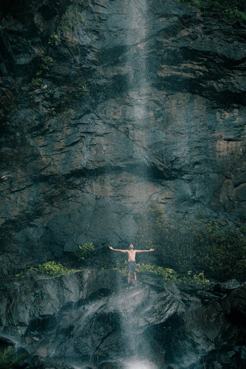 Man Enjoying Waterfall 