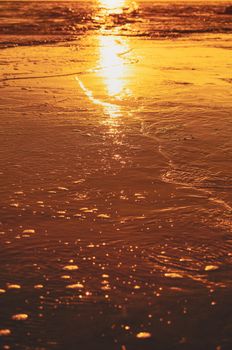 Captivating sunset reflection on the sands of Novigrad, Croatia. Perfect for travel inspiration.