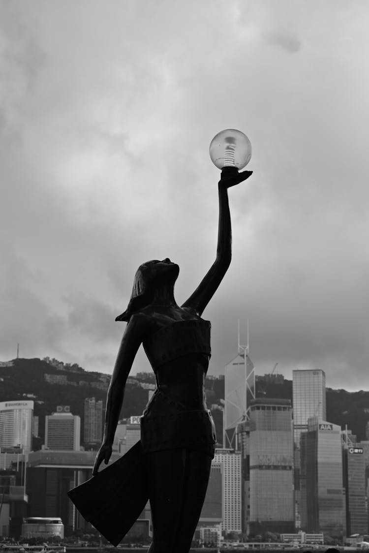 Hong Kong Film Awards Statue And View Of Skyscrapers In The Background 