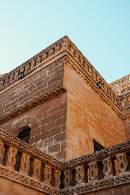 Free A beautifully crafted traditional stone facade in Turkey under a clear blue sky. Stock Photo