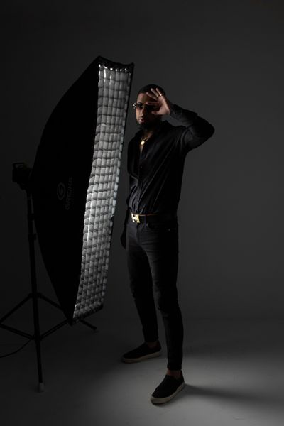 Man posing in a photography studio — photo by Marcos Felipe on Pexels