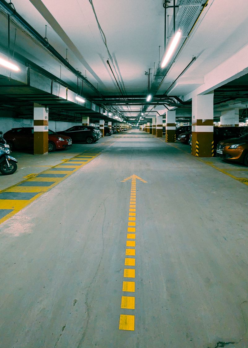 Underground parking garage with rows of empty stalls