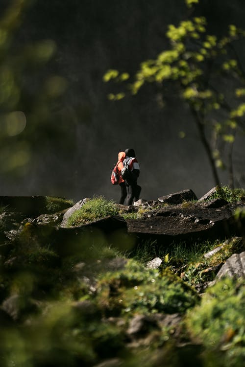 Hiking People behind Rocks