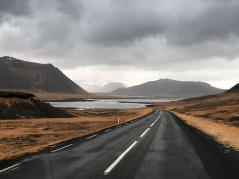 Explore the breathtaking Icelandic countryside with this stunning mountain road view, perfect for nature lovers.