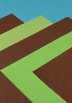 Abstract geometric art featuring brown, green, and blue shapes in a modern design.