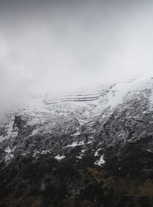 A snowy mountain with a snow covered slope