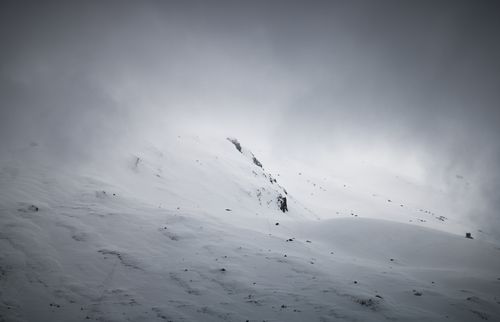 Free Serene snowy mountain scene in Hintertux, Austria, enveloped by mist. Stock Photo