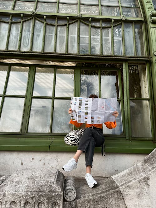 Woman Reading a City Map