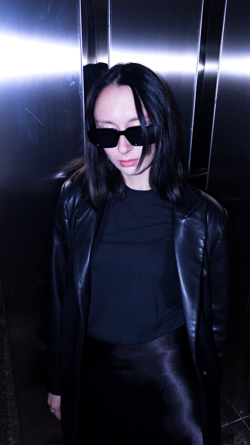 Woman in Sunglasses and Leather Jacket