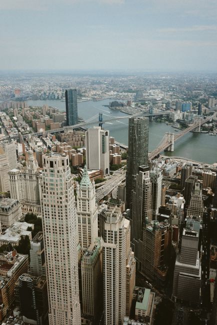 Aerial photograph of Manhattan, New York City showcasing skyscrapers and bridges.