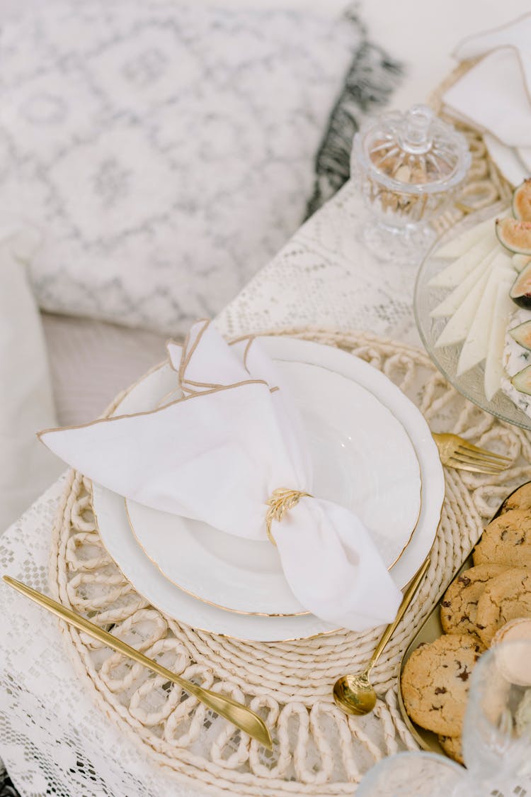 Napkin And Plates On A Set Table