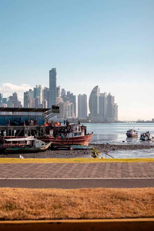 Promenade on Sea Shore and City Skyscrapers behind