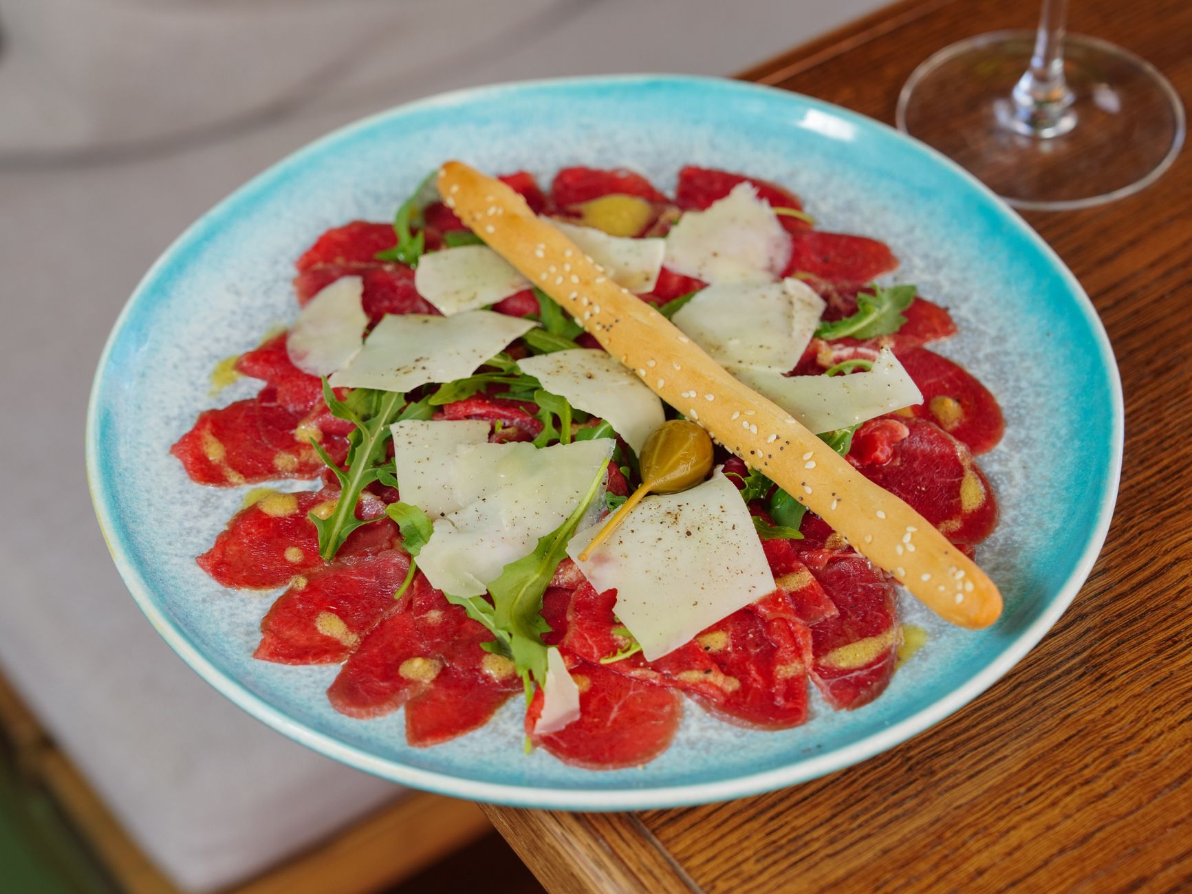 Fresh arugula salad with lemon and Parmesan shavings