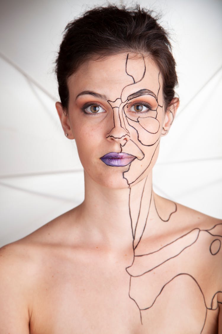 Portrait Of Woman With Drawings On Skin