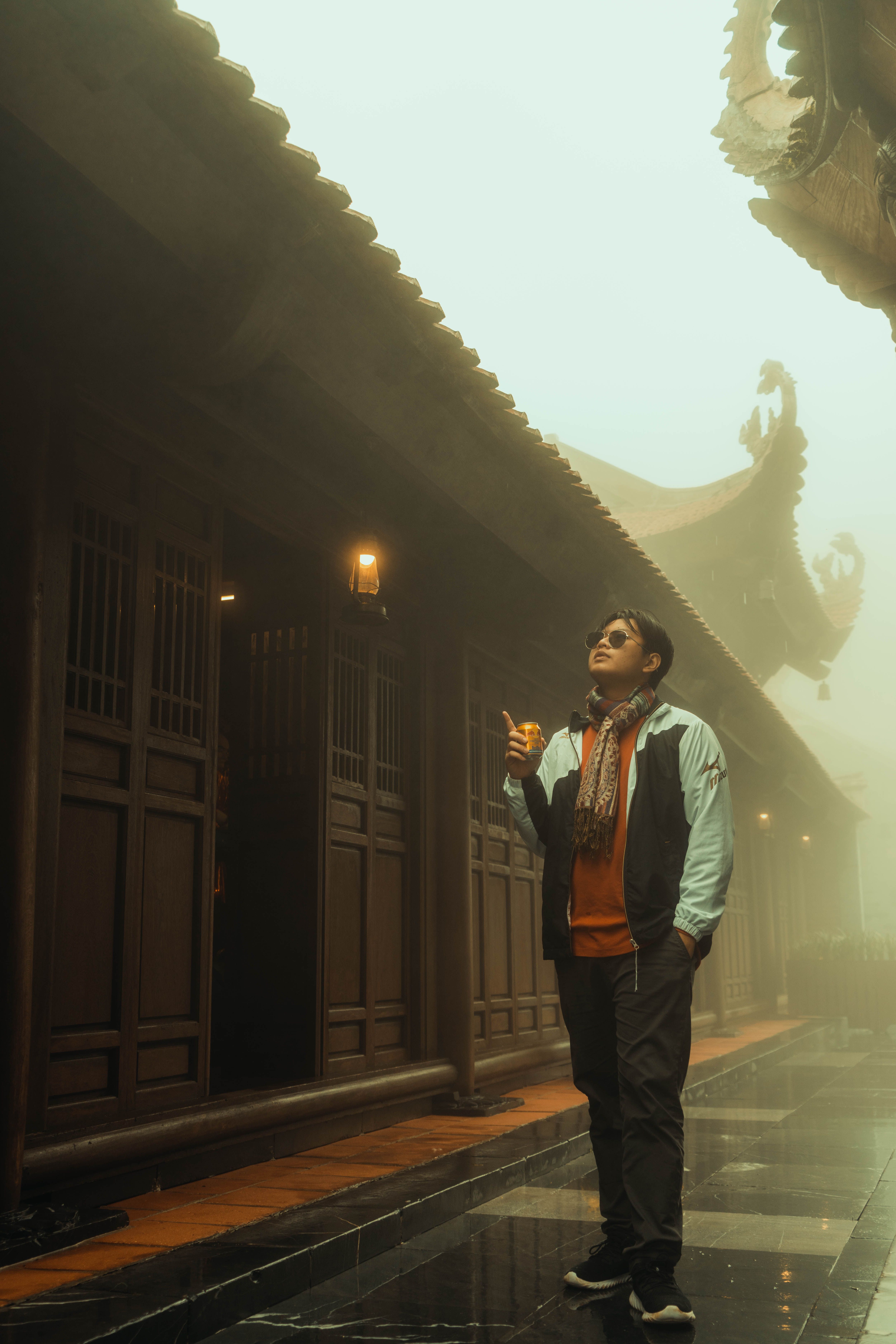 Man Standing in front of a Traditional Building · Free Stock Photo
