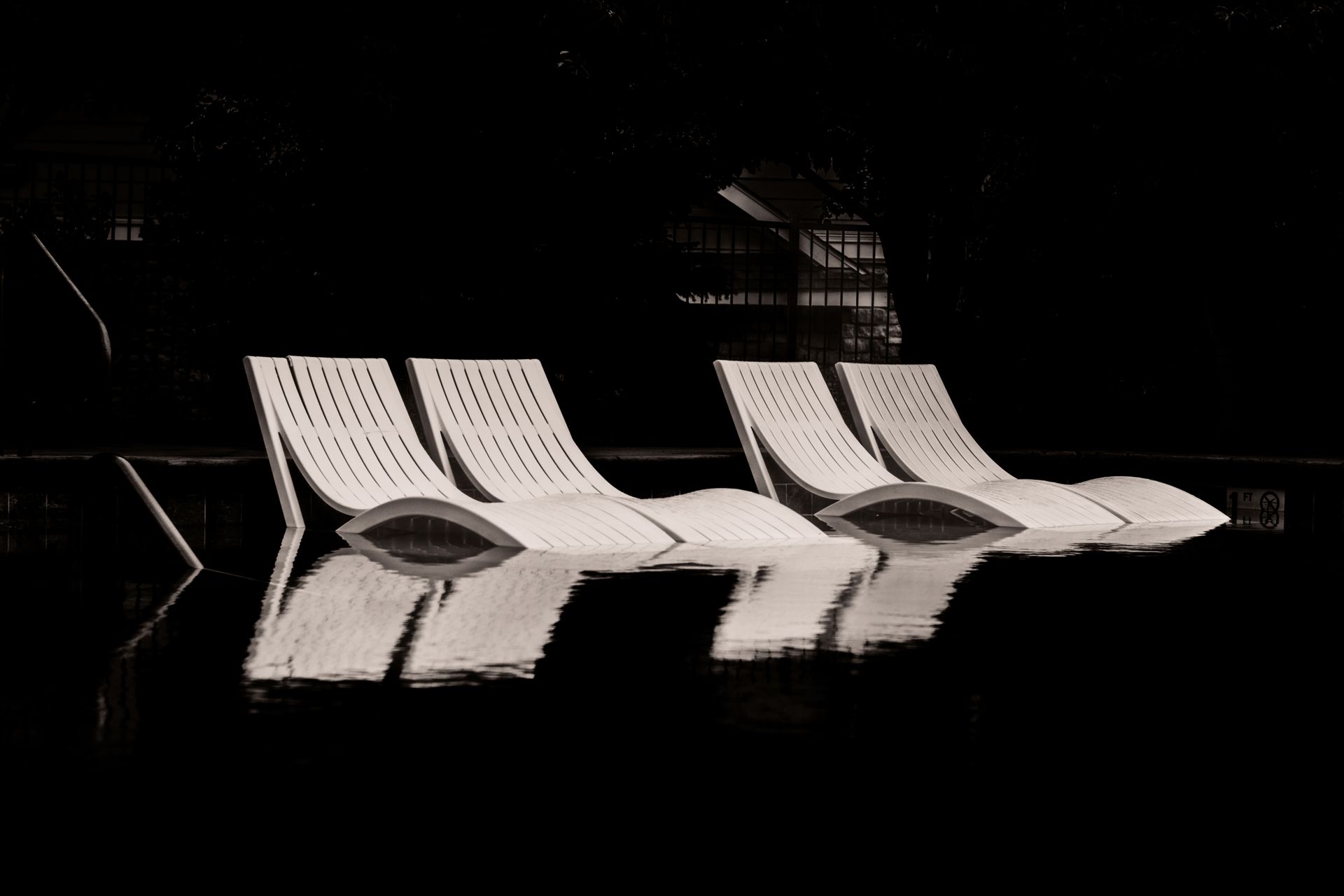 Deck Chairs in a Swimming Pool