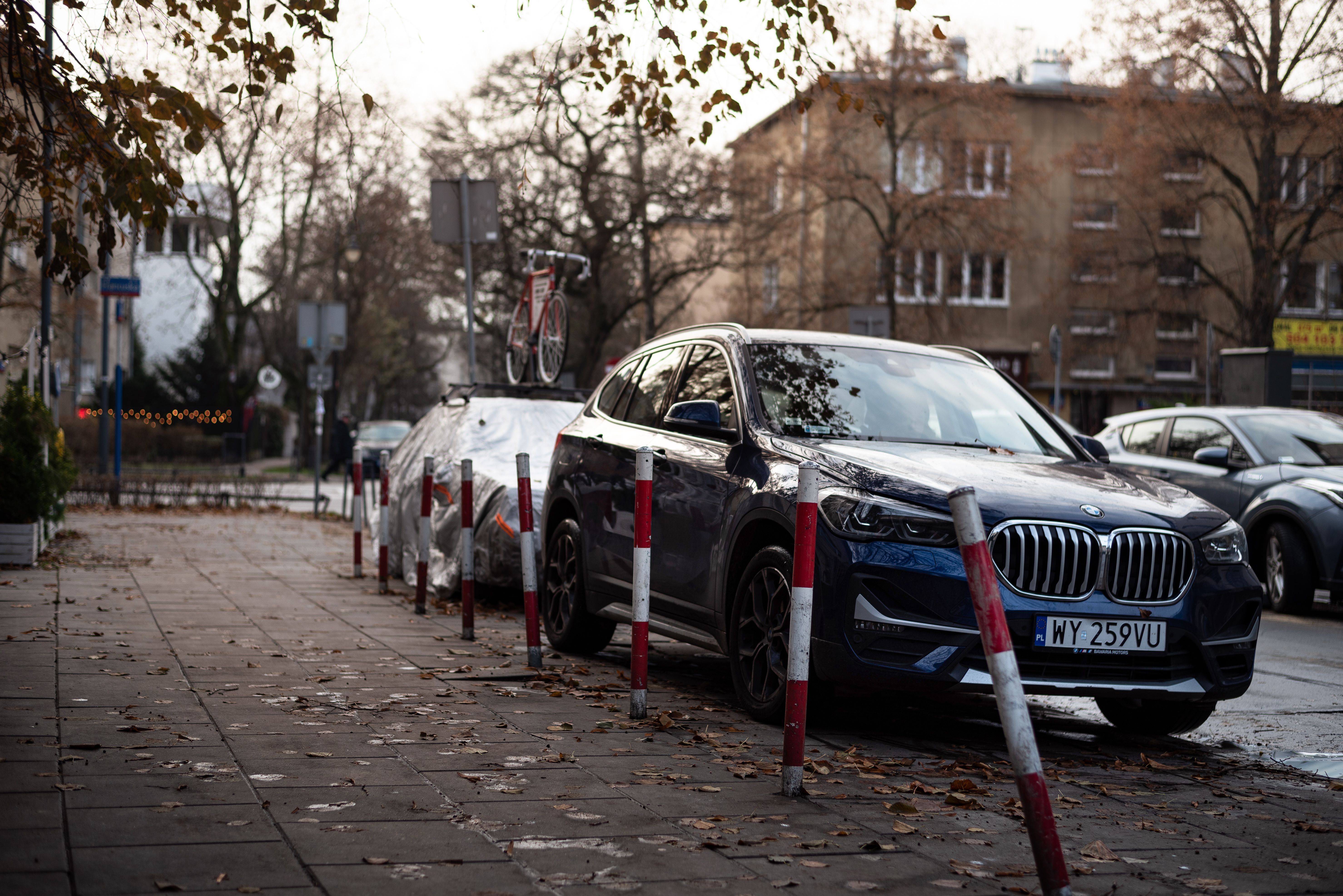 Parked BMW Car on the Sidewalk in the City · Free Stock Photo