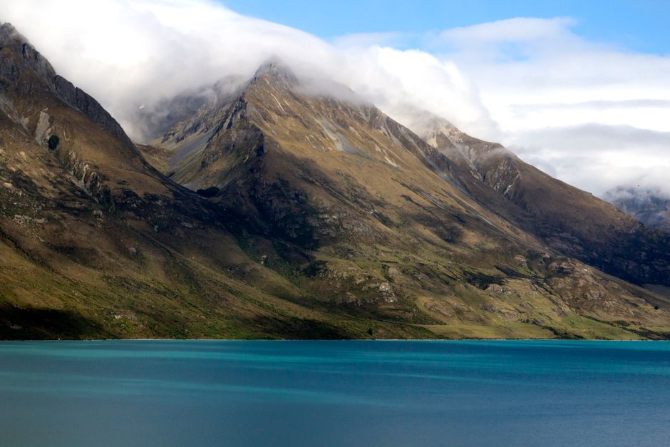 Amazing Milford Sound Business Class from Queenstown & Gourmet Cruise Review Review 2026 - Stunning view of the Southern Alps reflecting in Lake Wakatipu's turquoise waters.