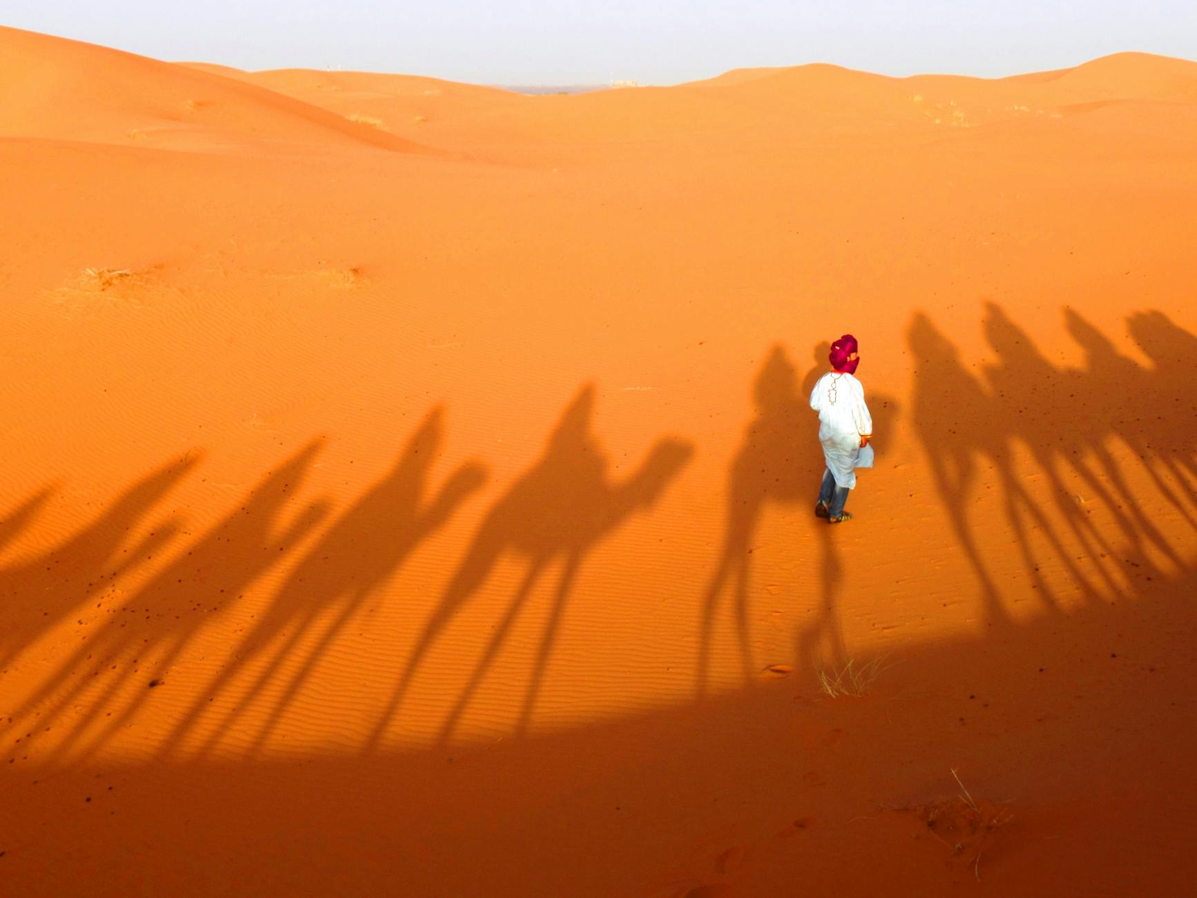 Person Standing On Sand · Free Stock Photo