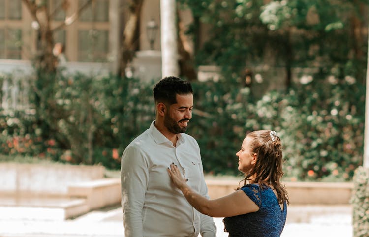 A Woman Touching A Man Chest