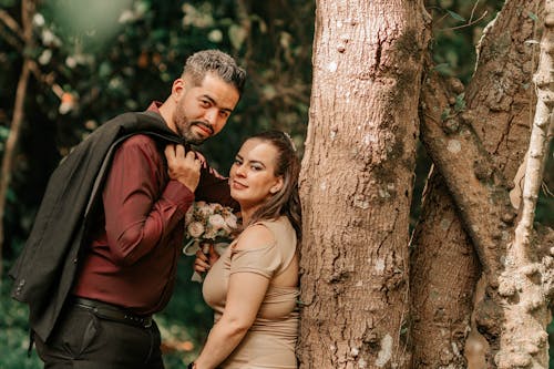 Couple Posing by Tree