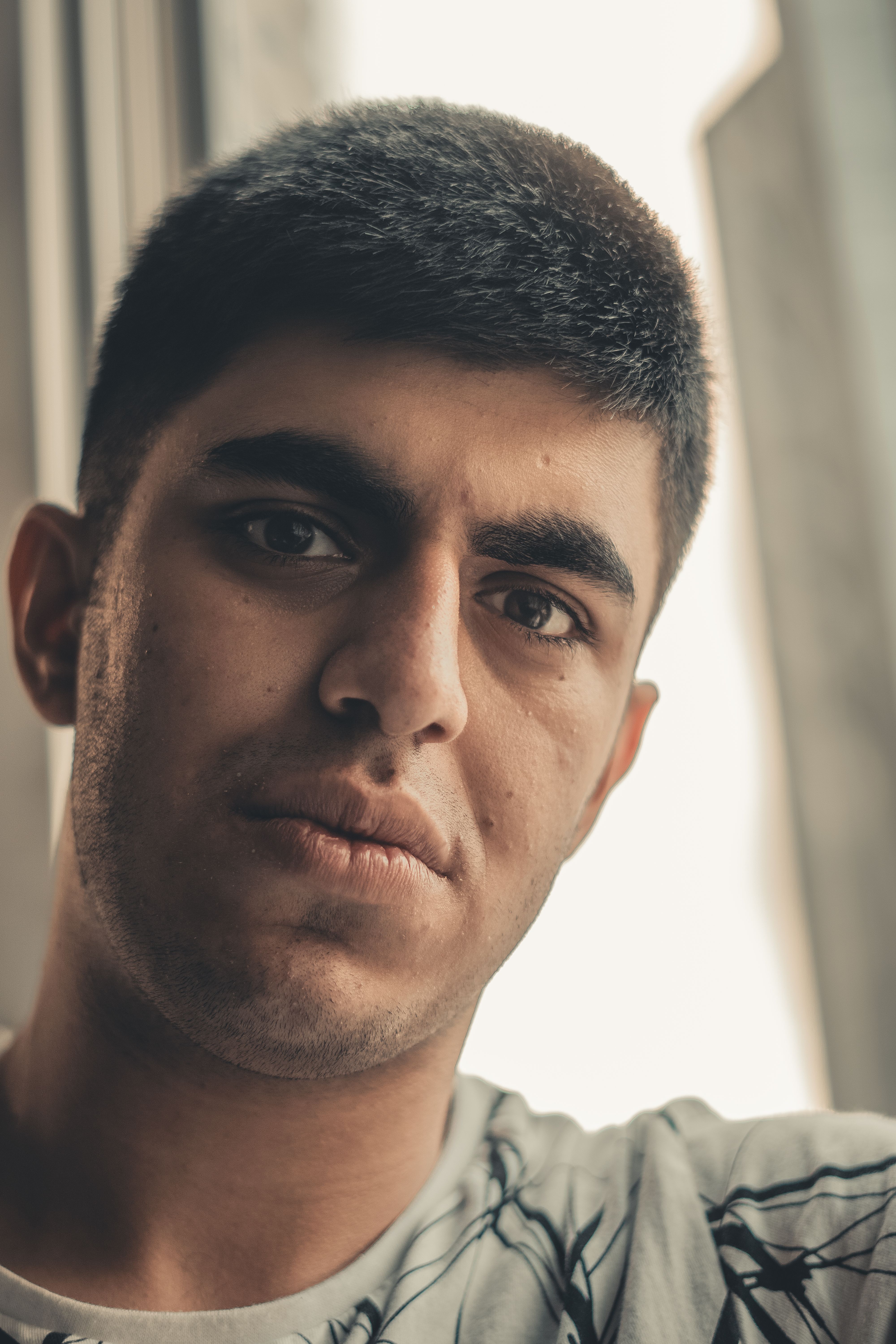 Close-up Portrait of a Young Brunette Man · Free Stock Photo