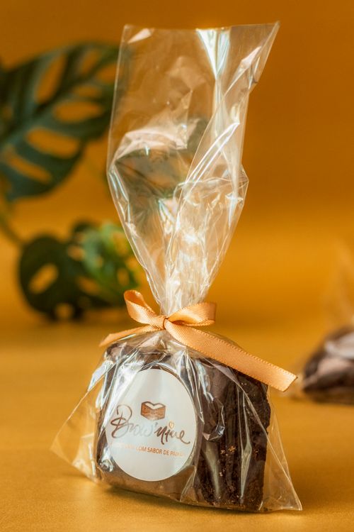 Free Delicious chocolate brownie neatly packed in a clear gift bag with a decorative ribbon. Stock Photo