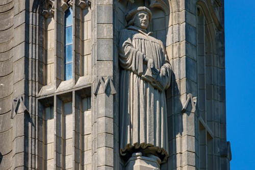 Sculpture of Man on Facade on Building in Chicago