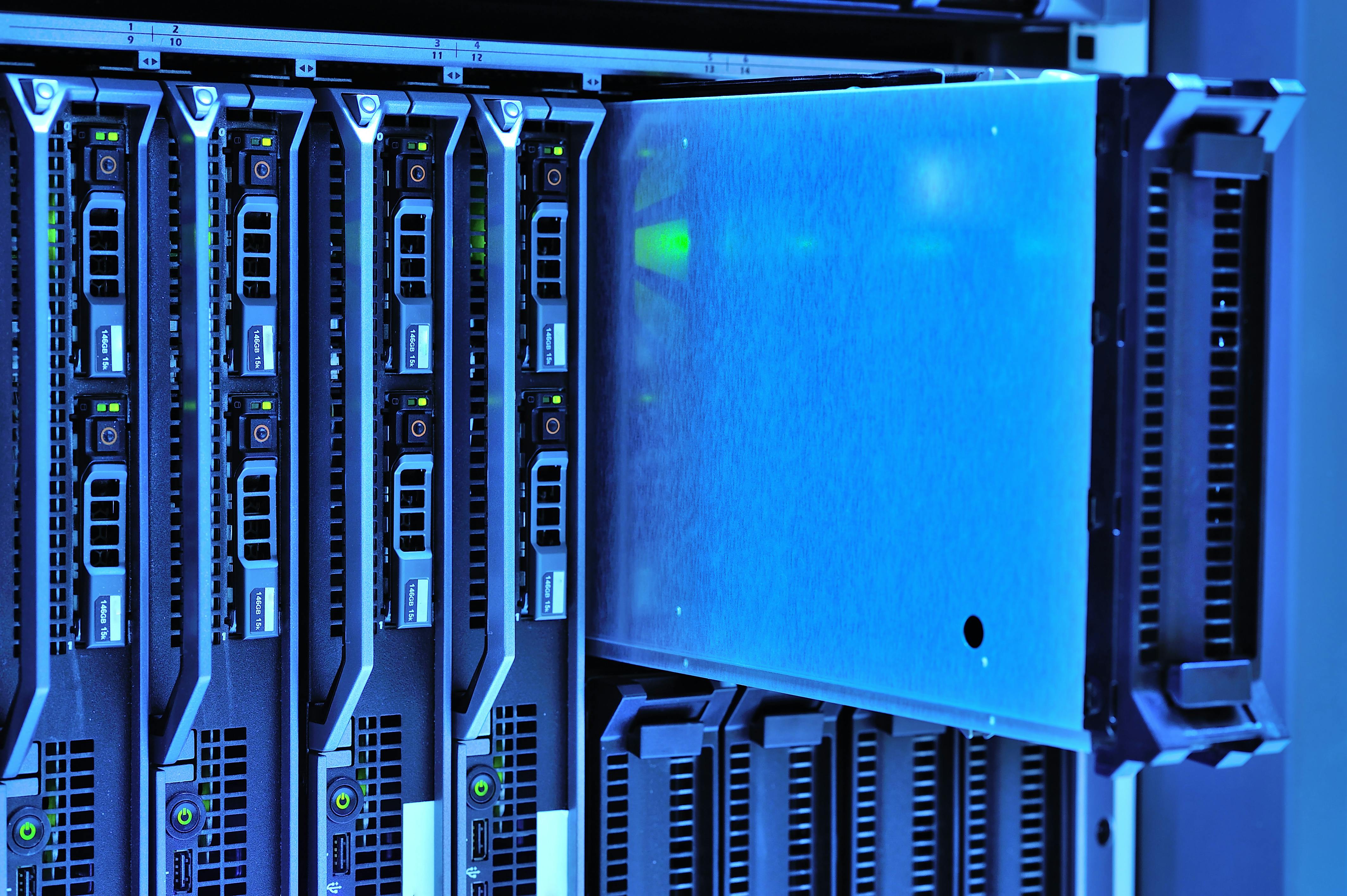 Detailed view of server racks with glowing lights in a data center environment.