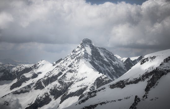 Breathtaking view of a snow-capped mountain peak in the Hintertux Alps, Austria.