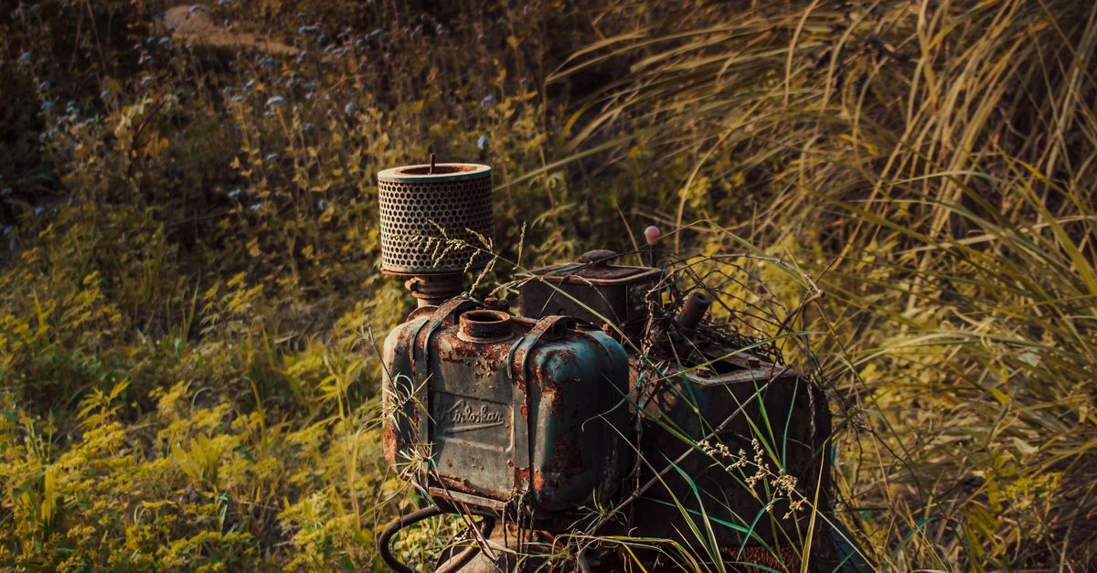 Abandoned Rusty Machine on Field · Free Stock Photo