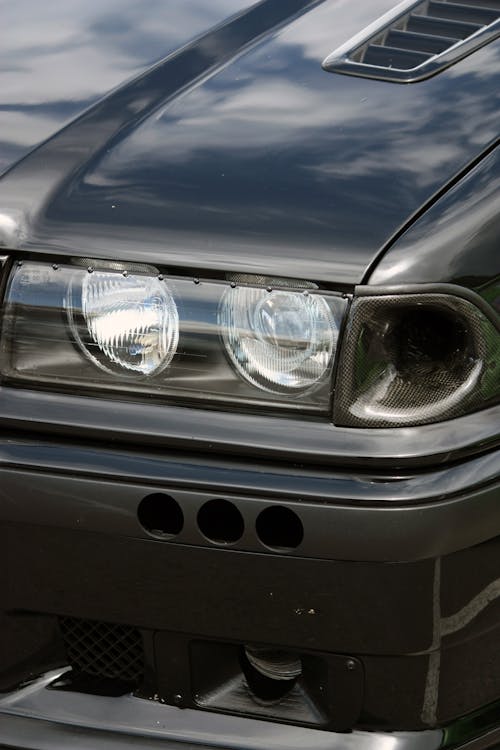 Headlight of Black BMW Car