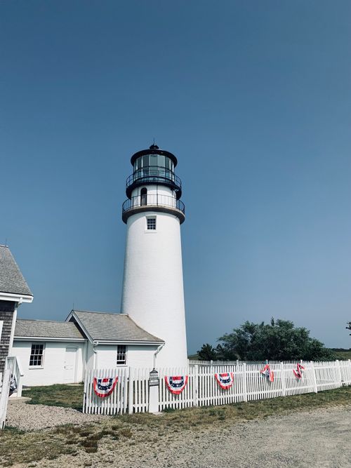 Free Scenic view of Highland Lighthouse in Massachusetts, USA, with clear blue sky. Stock Photo
