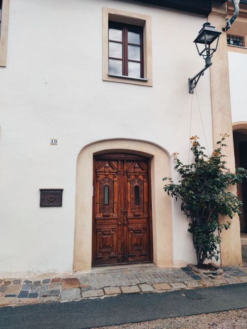 Free Charming wooden door with surrounding facade in Amberg, Bavaria. Explore traditional architecture. Stock Photo