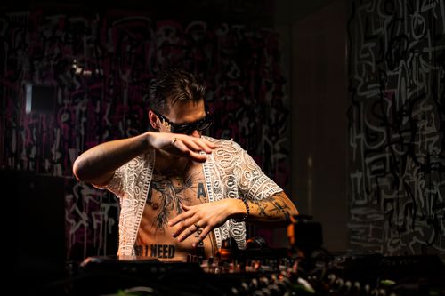Free A vibrant DJ mixing music in a lively nightclub scene in Lwiw, Ukraine. Stock Photo