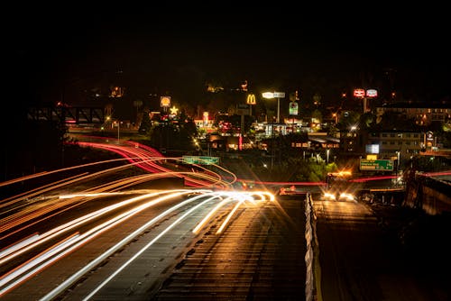 Long Exposure of Cars on a Street at Night in City 