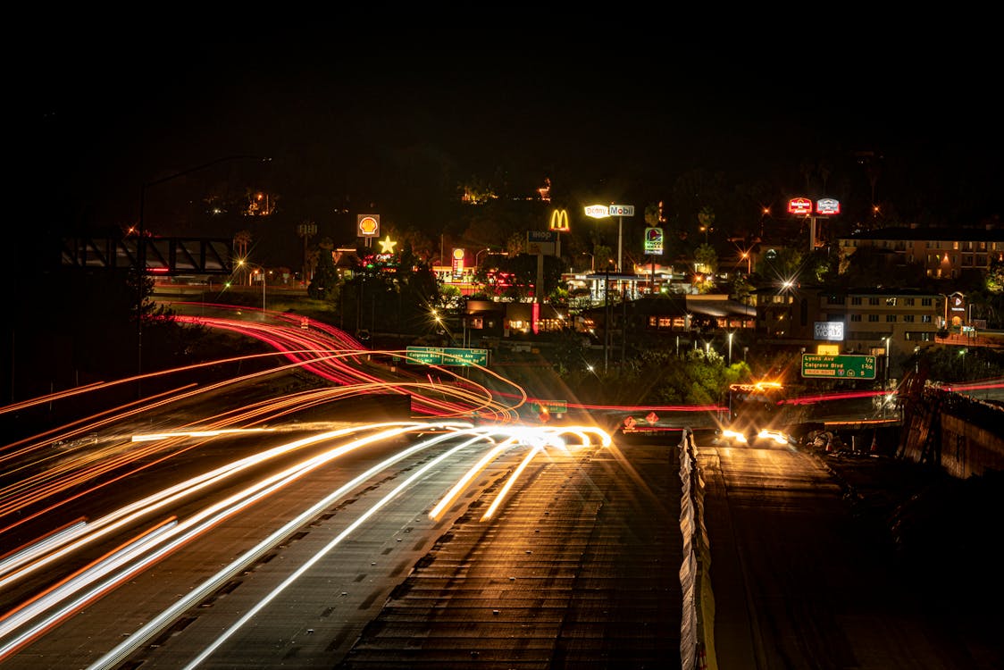 Long Exposure of Cars on a Street at Night in City 